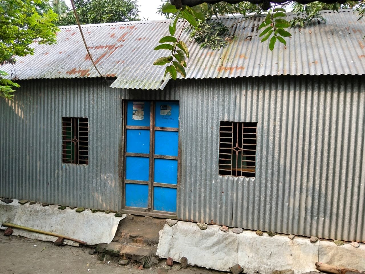 Tin house, blue windows.